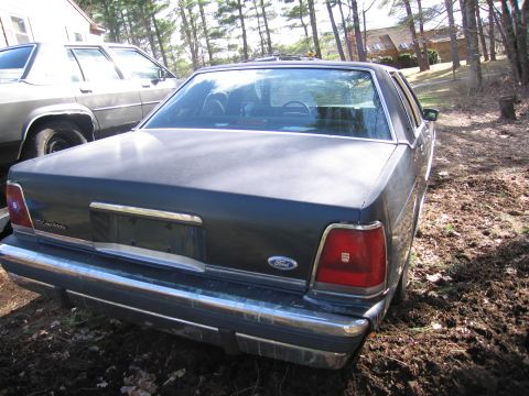 1991 Ford LTD Crown Victoria - 1991 Ford Crown Victoria LTD seen from the rear in a driveway setting.