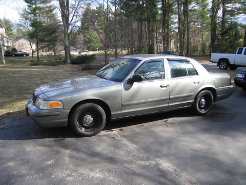 1991 Ford LTD Crown Victoria - Side profile of a 1991 Ford Crown Victoria LTD in a residential driveway.