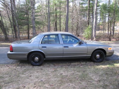 1991 Ford LTD Crown Victoria - Side profile of a 1991 Ford Crown Victoria LTD, showing its distinctive sedan body style.