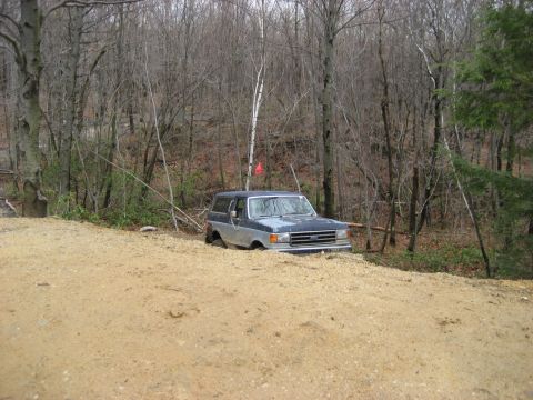 1991 Ford Bronco - Ford Bronco navigating a dirt trail in a wooded area.