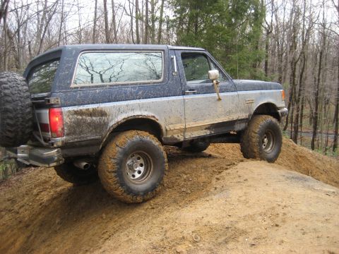 1991 Ford Bronco - This 1991 Ford Bronco navigates a muddy incline during an off-road event.