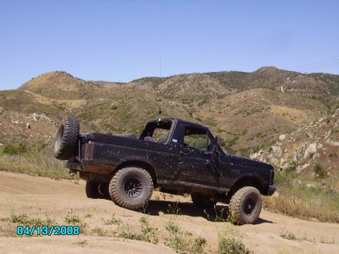1990 Ford Bronco - 1990 Ford Bronco seen off-roading on a sunny day.