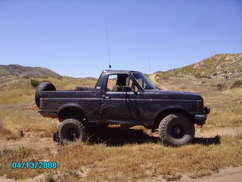 1990 Ford Bronco - This 1990 Ford Bronco is shown off-road on a sunny day.