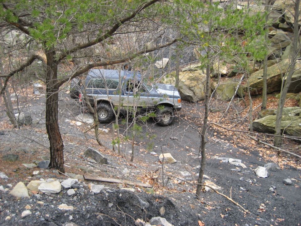 1991 Ford Bronco off-roading on a rocky trail