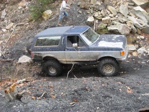 1991 Ford Bronco - This 1991 Ford Bronco is tackling a challenging off-road trail.
