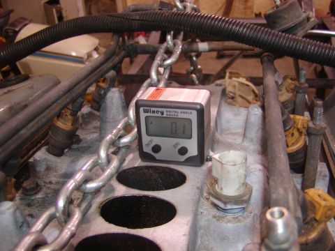 1991 Ford Bronco - Digital angle gauge used on an engine part during disassembly.