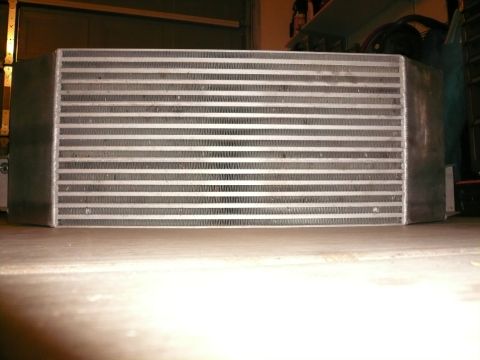 1996 Ford Probe - An intercooler part is shown in a garage setting.