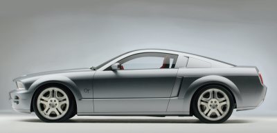2005 Ford Mustang - A silver 2005 Ford Mustang coupe is shown from the side against a plain background.