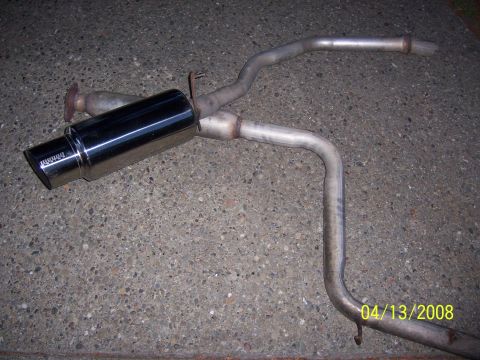 1994 Ford Probe - Aftermarket exhaust system part with chrome muffler and bent pipes.