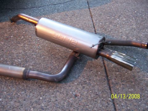 1994 Ford Probe - BORLA exhaust muffler and pipe assembly shown on asphalt surface.