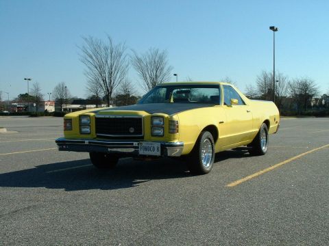 1978 Ford Ranchero - This 1978 Ford Ranchero pickup truck features a yellow body with a contrasting black hood and a custom license plate.