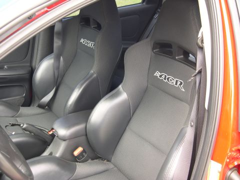1997 Ford Probe - Interior view of a car with "ACR" branded bucket seats and an orange exterior.