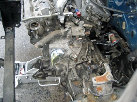 1993 Ford Probe - This is a close-up view of a vehicle's engine and transmission assembly, likely removed for repair or replacement.