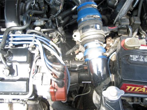 1993 Ford Probe - Close-up view of a car's engine bay, showing various components and wiring.