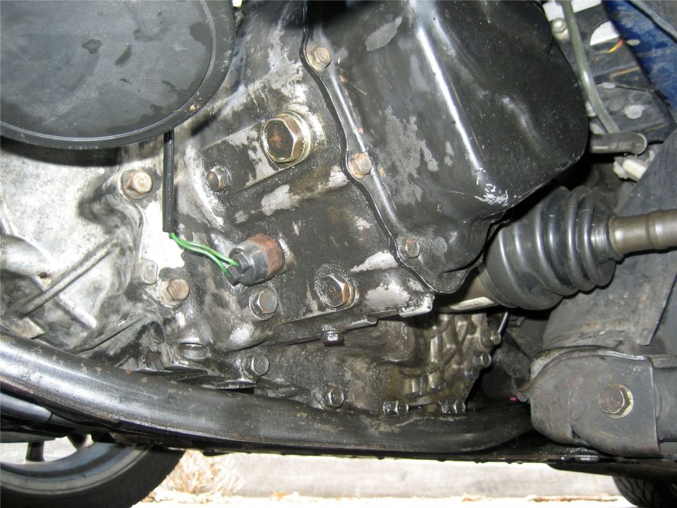 Engine oil pan and transmission assembly with green wire sensor