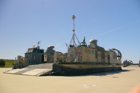 1986 Ford Bronco - Two LCAC vehicles are parked on a sunny day. One is labeled LCAC-16.