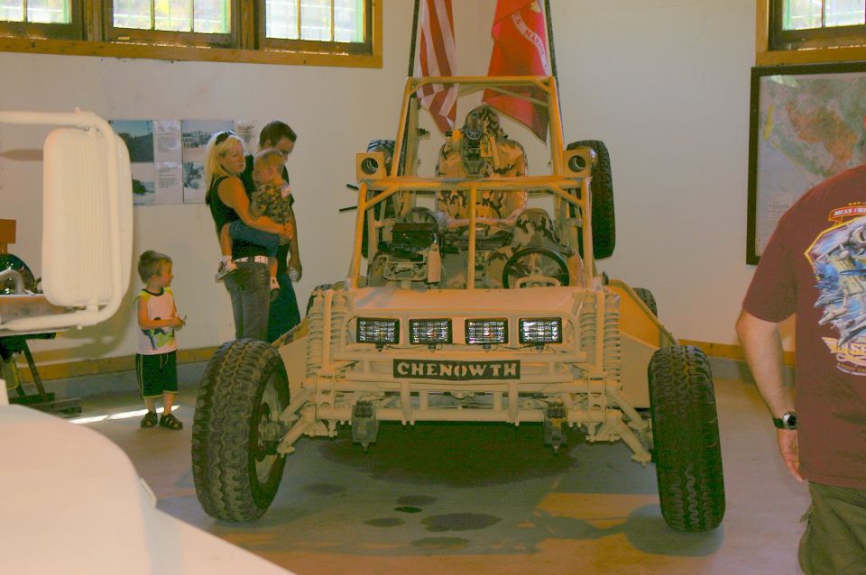 Chenowth dune buggy with three light bars and "CHENOWTH" text on the front, viewed from the front