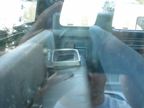 1993 Ford Bronco - Interior view of a vehicle, focusing on the seats and a chrome-trimmed console area.