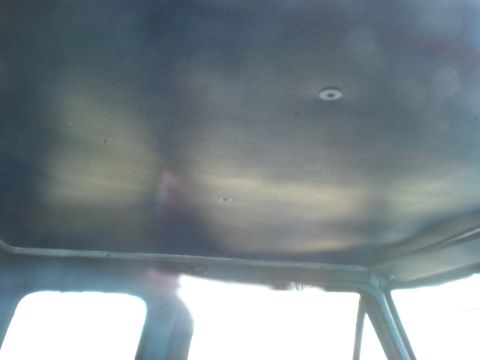 1993 Ford Bronco - Interior shot of a vehicle's headliner, showing the textured material and overhead lights.