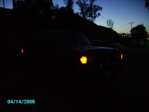 1990 Ford Bronco - Truck silhouette with headlights on at dusk. Date stamp 04/14/2008.