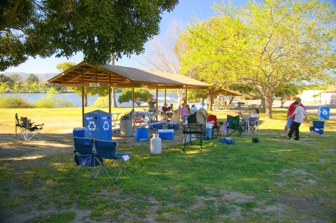1986 Ford Bronco - A sunny day at the park with families enjoying a picnic by the water.
