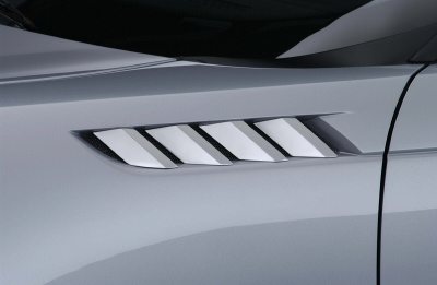 2004 Ford Thunderbird - Close-up of a silver side vent on a vehicle, showing angled slats.