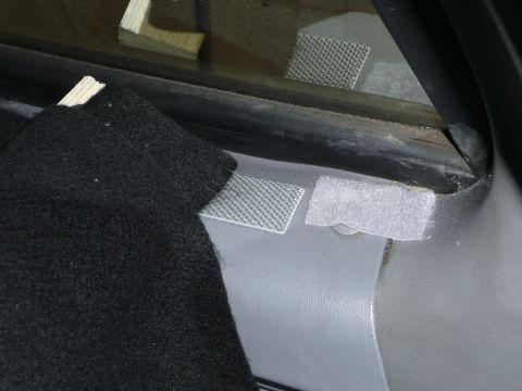 1991 Ford Bronco - Close-up of interior trim with anti-slip pads and black carpet visible.