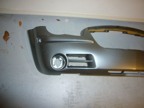 2007 Chrysler 300 - Front bumper assembly for a 2007 Chrysler 300, showing fog light housing and grille details.