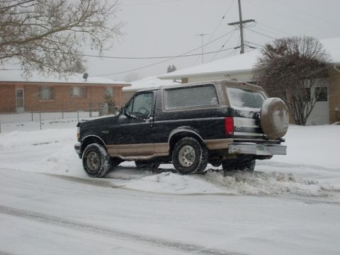 1996 Ford Bronco - This 1996 Ford Bronco navigates snowy terrain, its robust build.