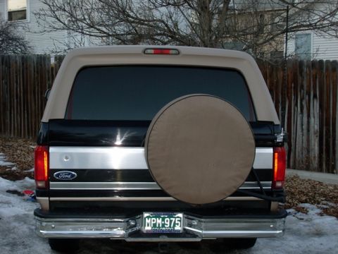1996 Ford Bronco - Rear view of a 1996 Ford Bronco showing the spare tire and license plate.