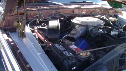 1979 Ford F-350 - Engine bay of a 1979 Ford F-350, showing the battery and air intake system.