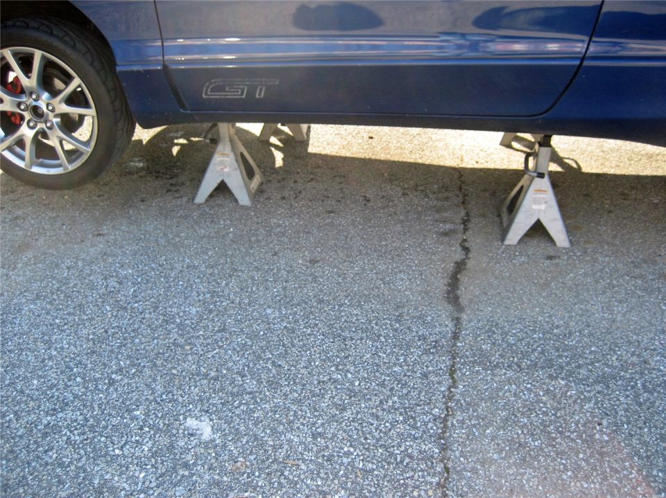 Blue car side with GT badge on jack stands