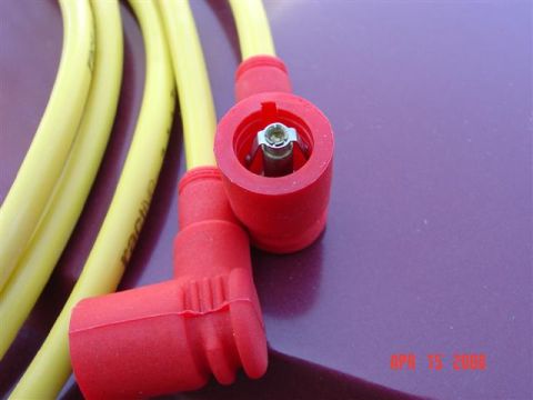 1993 Ford Probe - Close-up view of yellow spark plug wires and red boots, with a date stamp and website visible in the corner.