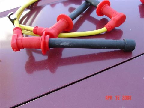 1993 Ford Probe - Spark plug wires with red boots are visible on a dark red surface, with a timestamp indicating April 15, 2008.