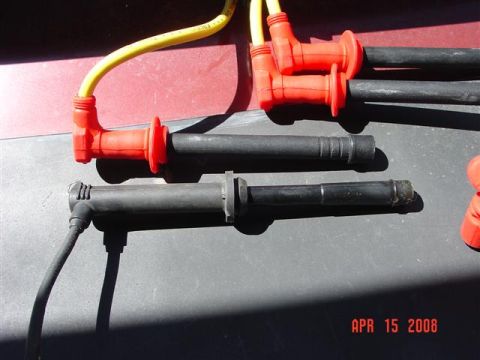 1993 Ford Probe - Spark plug wires and boots are laid out on a surface, with a date stamp of APR 15 2008.