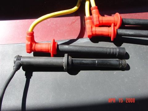 1993 Ford Probe - Close-up view of spark plug wires and boots, with a date stamp in the corner.