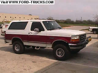 1994 Ford Bronco - This 1994 Ford Bronco is shown in a 3/4 front view. The vehicle features a two-tone paint scheme with white and red.