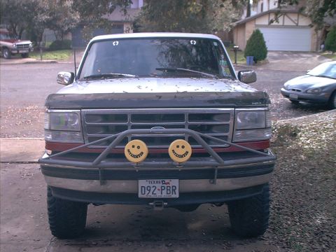 1994 Ford Bronco - Front view of a 1994 Ford Bronco with a custom bumper and auxiliary lights.