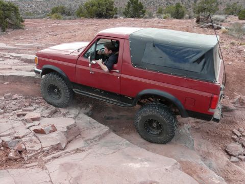 1990 Ford Bronco - This 1990 Ford Bronco navigates a challenging rocky trail during an off-road event.