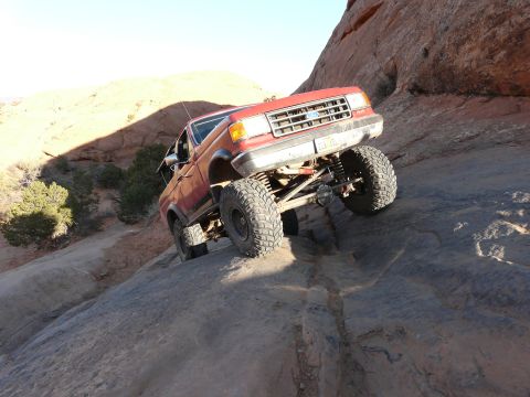 1990 Ford Bronco - This 1990 Ford Bronco tackles a challenging off-road obstacle.