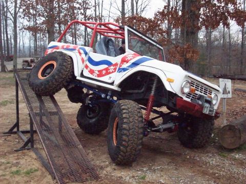 1978 Ford Bronco - A modified 1978 Ford Bronco is shown on a ramp with a second vehicle visible in the background.