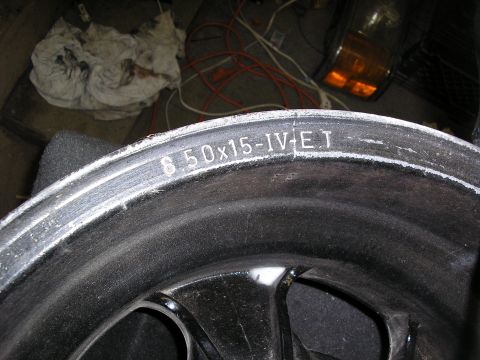 1987 Ford Bronco - Close-up of a wheel rim showing size and offset markings.