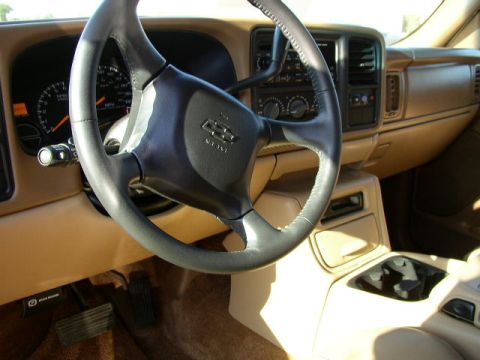 1995 Ford Bronco - Interior view of a Chevrolet SUV, focusing on the steering wheel, dashboard, and center console.