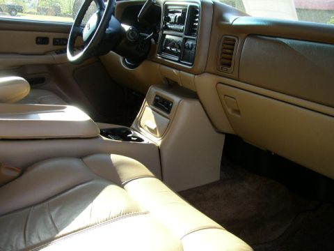 1995 Ford Bronco - Interior view of a truck's cabin, tan leather seats and dashboard details.