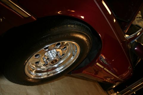 1992 Ford Crown Victoria - The detail of the wheel and fender shows a portion of a car's side profile.