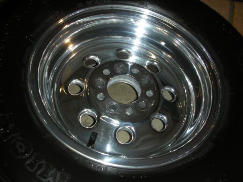 1992 Ford Crown Victoria - A polished chrome wheel with a black tire is shown in detail.