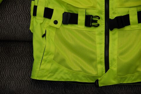 1998 BMW R1100GS ABS - This image shows a detailed view of a high-visibility motorcycle jacket, adjustable straps and ventilation panels.
