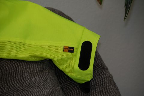 1998 BMW R1100GS ABS - Close-up of a neon yellow motorcycle jacket sleeve, showing the Cordura fabric label and a velcro closure.