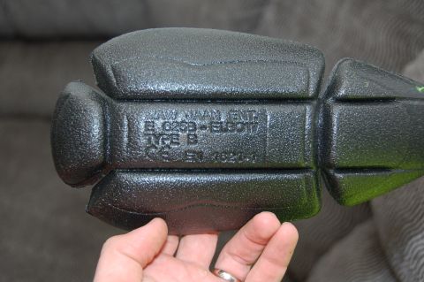 1998 BMW R1100GS ABS - A close-up shows a black motorcycle armor pad with embossed text indicating its type and safety certification.