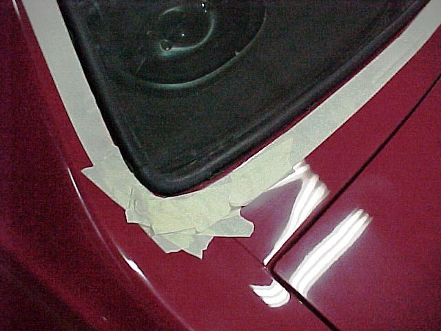 Masking off around the rear window before installing the stainless trim